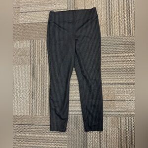 Polyester Rayon Spandex blend. Large band on the top.